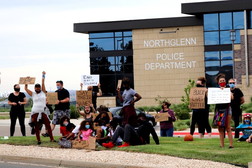 Protesters gather in front of the Northglenn Police Department in the city's Community Center Drive Justice Center on June 6. The group of about 65 marched there from E.B. Rains Park and Back.